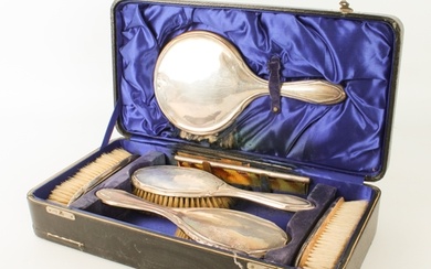 A cased George V silver-mounted dressing-table set - Birming...