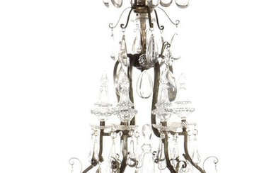 A circa 1900 Baroque style patinated bronze 12-light prism chandelier. H. 115. Diam. 70 cm.