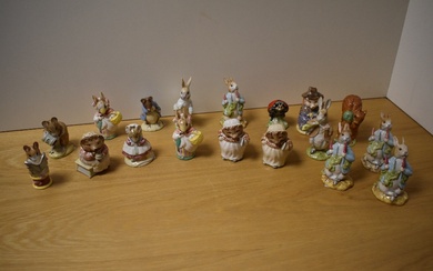 A collection of sixteen Royal Albert and two Beswick Pottery Beatrix Potter figures, to include