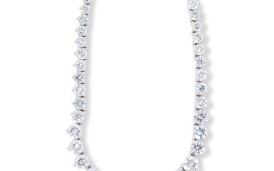 A diamond and fourteen karat white gold rivière necklace