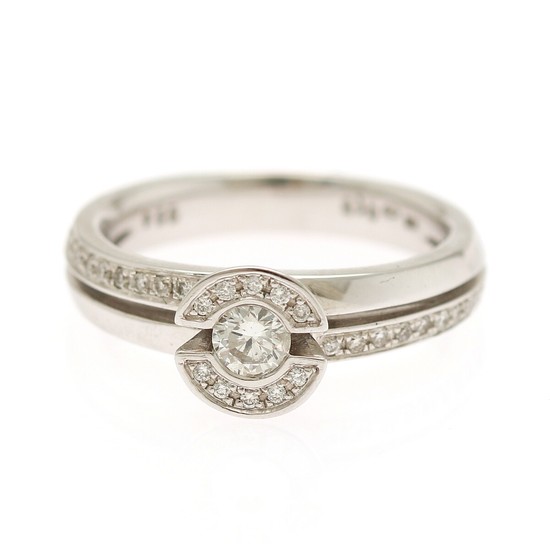 A diamond ring set with a brilliant-cut diamond weighing app. 0.24 ct. encircled by numerous brilliant-cut diamond., mounted in 14k white gold. Size 55.