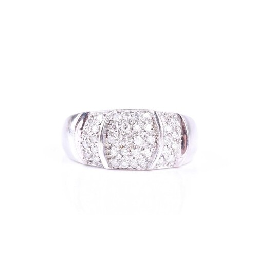 A diamond set dress ring, the wide convex 9ct white gold ban...
