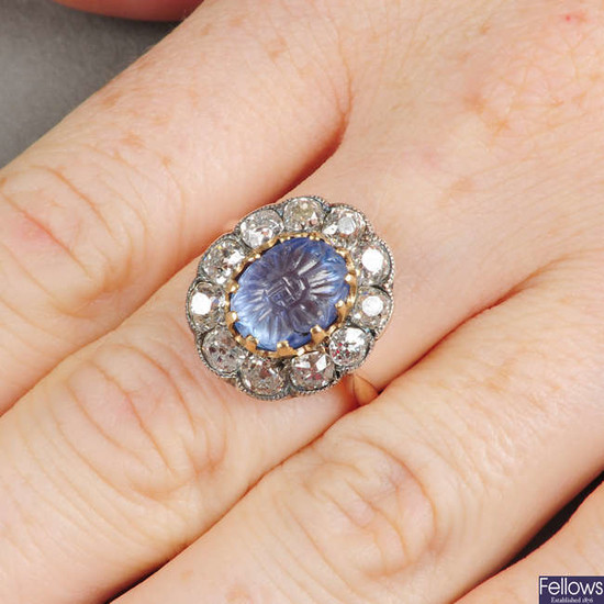 A foliate carved sapphire and old-cut diamond cluster