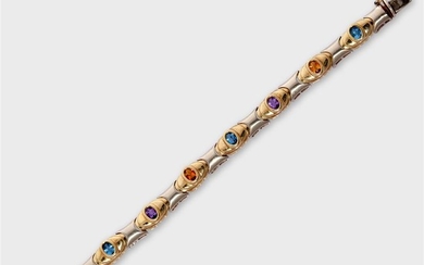 A gem-set fourteen karat bi-color gold strap bracelet designed...