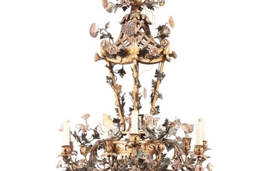 A gilt and patinated metal and porcelain chandelier, attributed to maison Jansen, second half 20th century | Lustre en métal doré, laqué vert et fleur de porcelaine, attribué à la maison Jansen