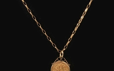 A gold Half Sovereign pendant and chain.