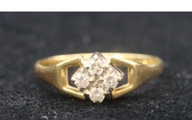 A gold ladies' cluster ring set with 4 small diamonds with o...