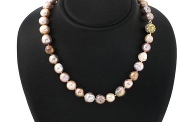 A graduated pearl necklace set with numerous multi-coloured semi-baroque cultured South Sea...