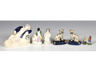 A group of five Staffordshire figures, of a Sleeping Boy wit...