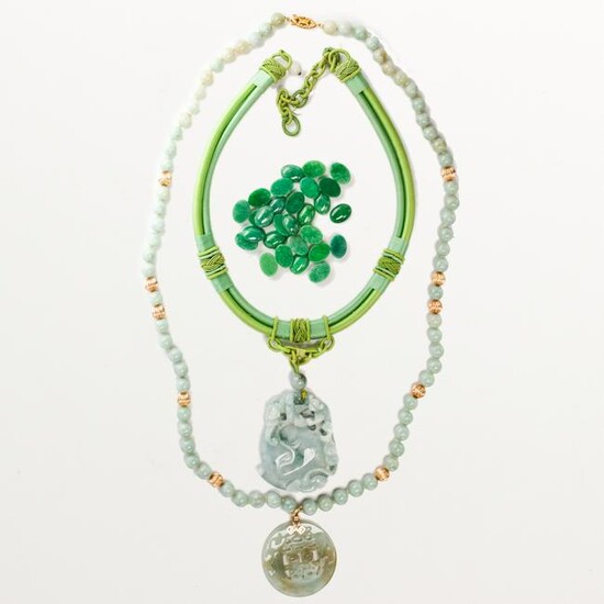 A group of jade necklaces and unmounted stones