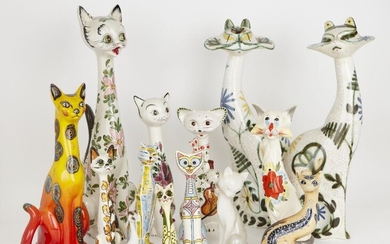 A group of pottery cats with elongated necks and pronounced whiskers, of varying size and design, to include a pair of Cinque Port Pottery cats with floral decoration, factory stamp to base, 53cm high, and others, tallest 56.5cm (lot)