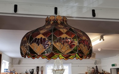 A large Tiffany style lamp shade, 64.5cm wide. ...