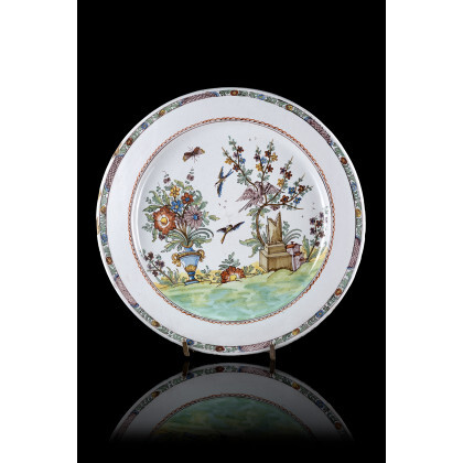 A late 18th century Ferniani manufacture, Faenza. Majolica decorated plate decorated (d. cm 35) (chips)