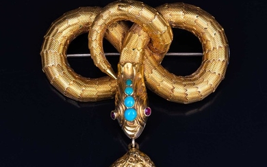 A mid 19th Century yellow metal brooch, in the form of a coiled snake with simulated scales