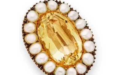 A mid 19th century foil back topaz and pearl brooch.