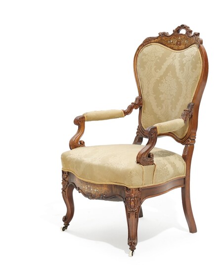 A mid 19th century rosewood Napoleon III armchair with brass and mother of pearl inlays.
