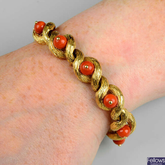 A mid 20th century 18ct gold coral and textured gold bracelet, by Cartier.