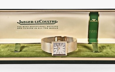 A mid 20th century LeCoultre gold wrist watch with boxes and papers