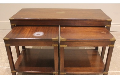 A nest of three mahogany campaign revival tables, late 20th ...