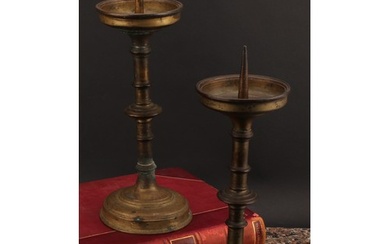 A pair of 17th century style brass pricket candlesticks, kno...