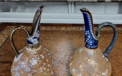 A pair of 19th Century Royal Doulton salt glaze bud vases wi...