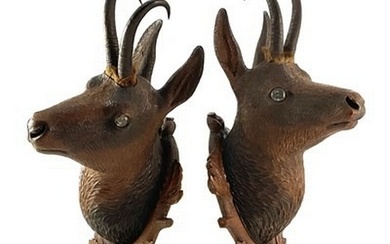A pair of Black Forest carved wooden and Chamois horn mounte...