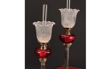 A pair of EPNS Corinthian column table oil lamps, frilled sh...
