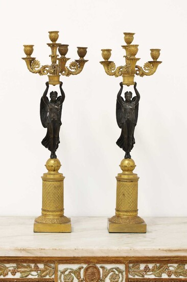 A pair of Empire D'or ormolu and bronze candelabra