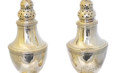 A pair of George III silver casters