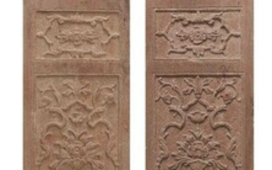 A pair of Mughal carved red sandstone panels, North India, 17th century, of rectangular form, carved in registers with floriated vases, 185 x 35.5cm. (2) (VAT charged on hammer price)