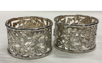 A pair of Victorian silver napkin rings with pierced decorat...