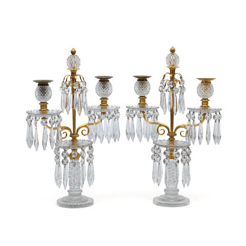 A pair of ormolu-mounted, cut and moulded glass two-light candelabra