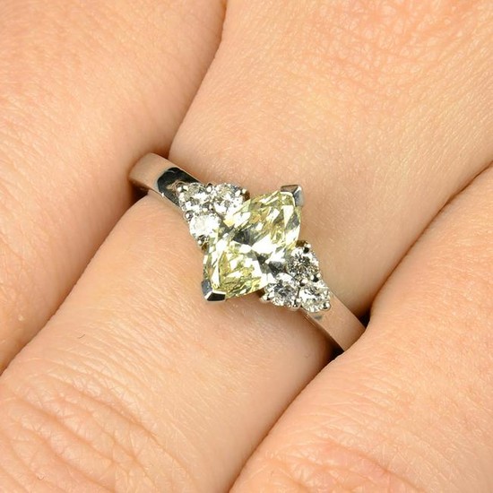 A platinum marquise-shape 'yellow' diamond ring, with