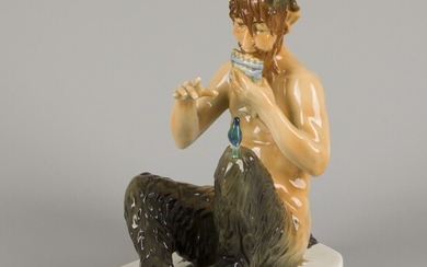 A polychromed porcelain statuette of a pan-flute playing faun, Germany, 2nd half 20th century.