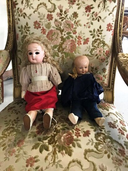A porcelain twin doll (with a damaged head),...