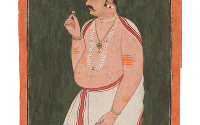 A prince in a white dhoti holding a rose, preparing...