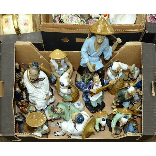 A quantity of Chinese glazed porcelain figures of farmers, m...