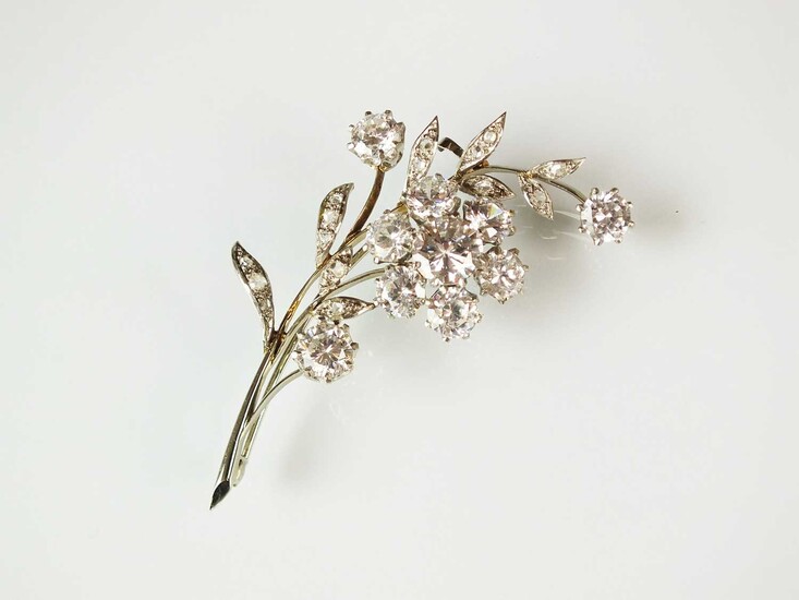 A rose cut diamond and cubic zirconia floral spray brooch