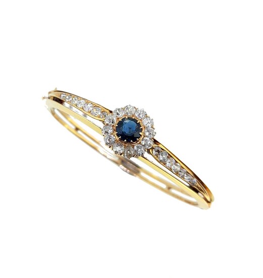 A sapphire and diamond cluster style bangle