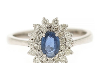 A sapphire and diamond ring set with a sapphire weighing app. 0.40 ct. encircled by numerous diamonds, totalling app. 0.45 ct., mounted in 14k white gold.