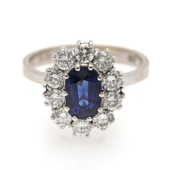NOT SOLD. A sapphire and diamond ring set with a sapphire weighing app. 1.53 ct. encircled by numerous diamonds, mounted in 18k white gold. Size 52.5. – Bruun Rasmussen Auctioneers of Fine Art