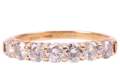 A seven-stone diamond half-hoop ring in 18ct yellow gold, se...