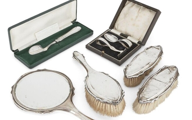 A silver stilton scoop with Millennium hallmarks, Sheffield, 2000, William Yates, 19.1cm long, together with a cased silver baby spoon and pusher set, Birmingham, 1933, Barker Bros., engraved N.G; and a silver mounted vanity set comprising hand...