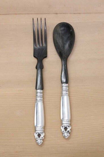 A silver/metalware-handled and horn serving/salad spoon and fork