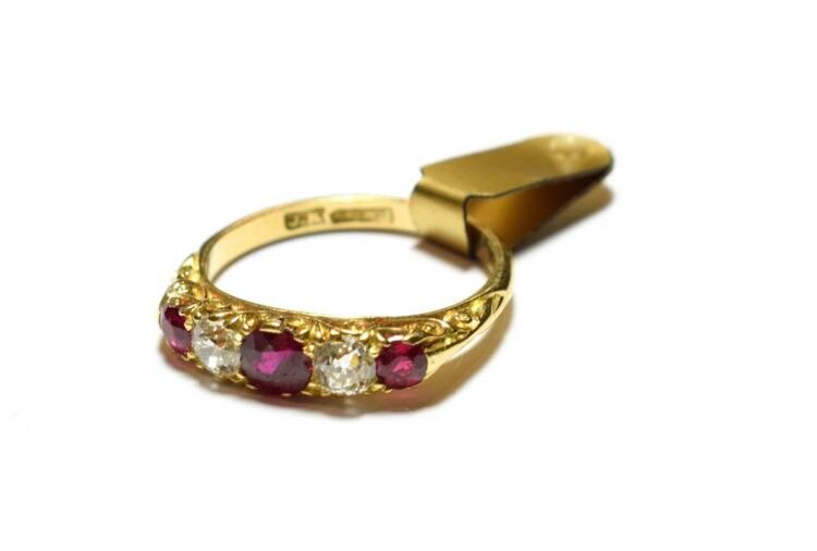 A synthetic ruby and diamond five stone ring, three graduated...