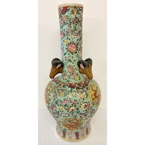 A very large ceramic long necked vase, decorated with peache...