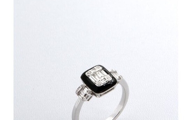 A white gold ring with a central motif set with baguette and brilliant-cut diamonds, with identical shoulders on each side of the omitted entourage.
