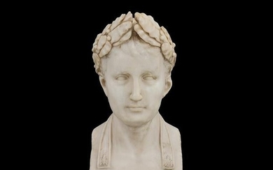 A white marble bust of Napoleon with a laurel crown
