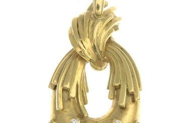 An 18ct gold diamond pendant.Estimated total diamond