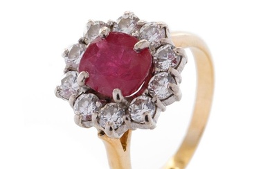 An 18ct yellow gold ruby and diamond cluster ring, with cent...